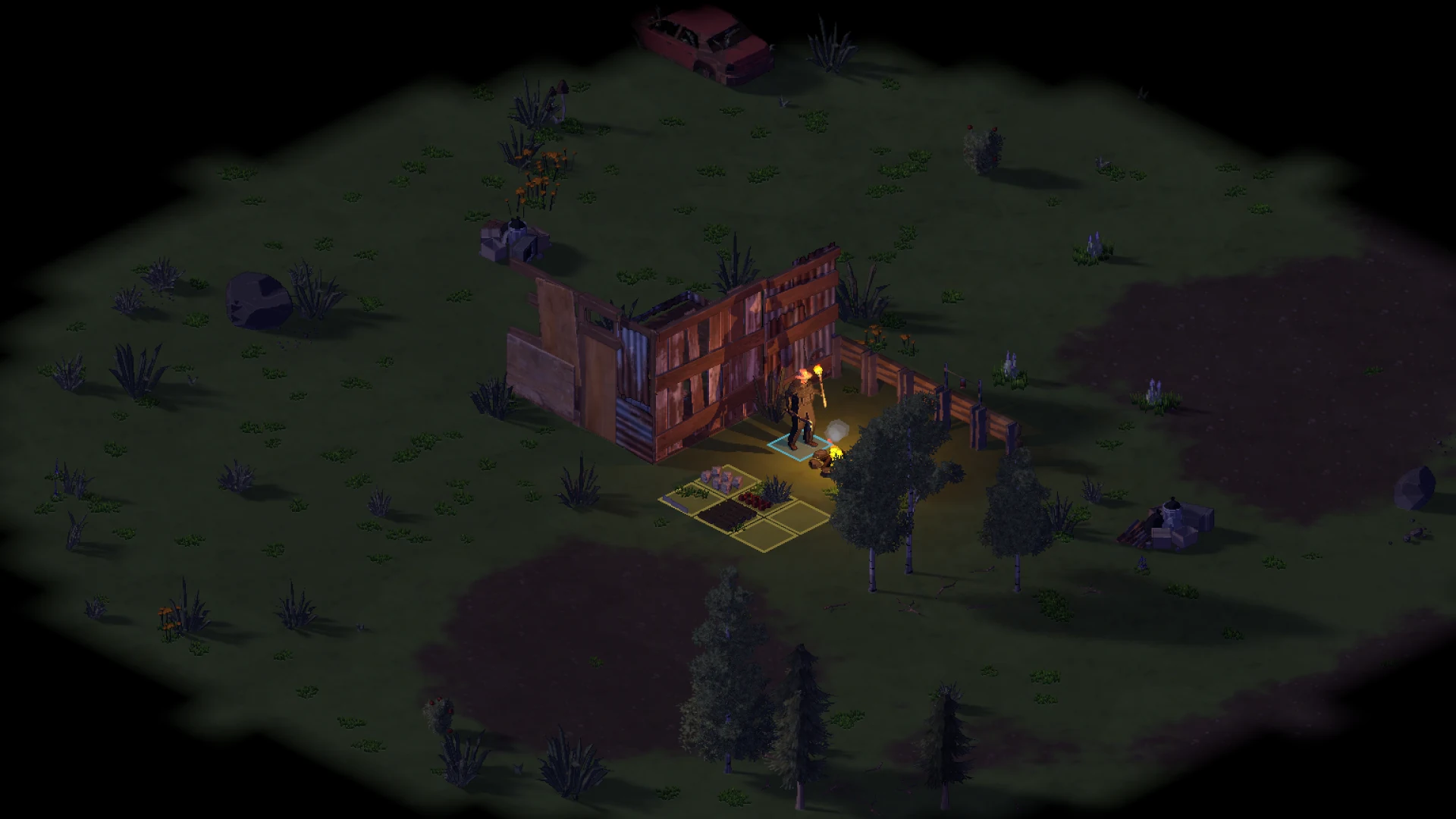 The campfire lights a shelter in the darkness